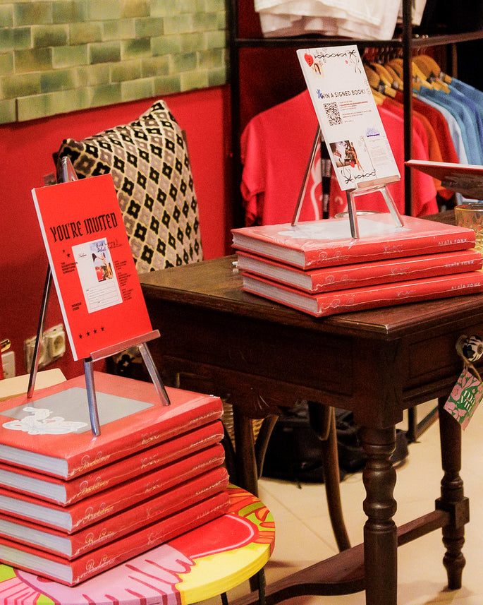 Books and art on a table at Mayiu Store